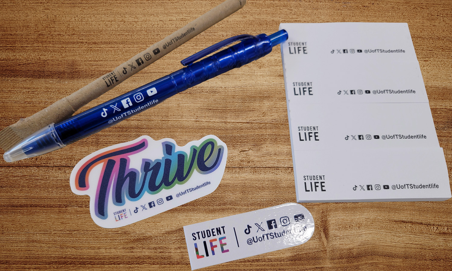 swag items: pen, highlighter, bookmark and post it notes
