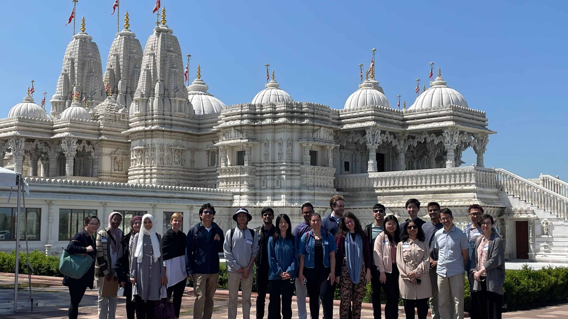 Participants of Interfaith bus tour in front of Hindu temple