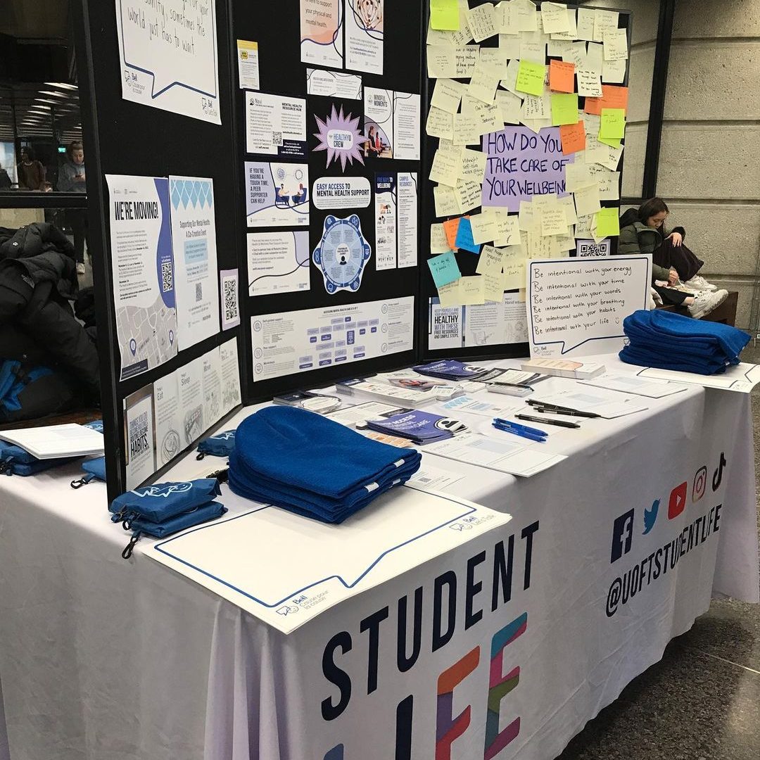 Mental Health outreach table with brochures and swag