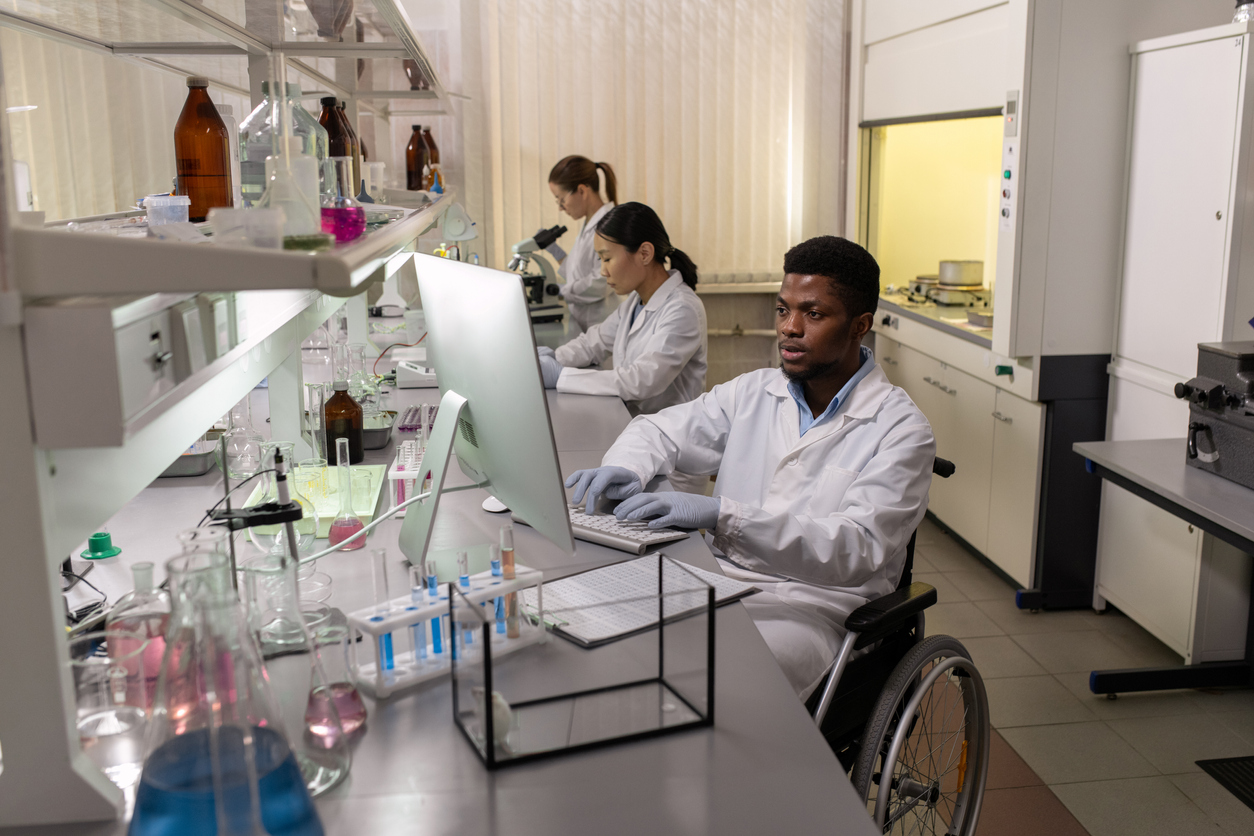 student in a wheelchair working in a lab