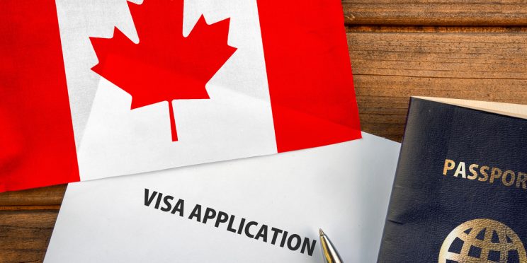 visa application, passport and Canadian flag