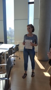 Margaryta Ignatenko stands in a board room at Rotman sharing memories of her summer project.