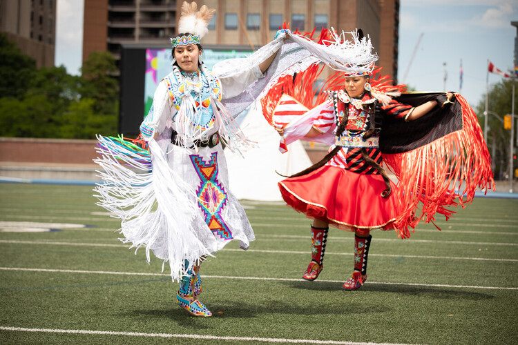 Alanna Pasche and Deanne Hupfield perform at an Indigenous vaccine clinic that was hosted at U of T's Varsity Stadium (photo by Johnny Guatto)