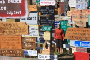 Image of woman surrounded by street signs