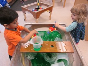 Girl and Boy at Water Table