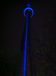 Another nighttime shot looking up at the CN Tower from it's base, but this time it's lit up in blue and wet with rainfall