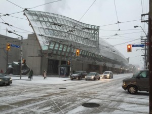The wavy exterior design of the Art Gallery of Ontario, totally draped in snow