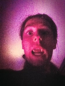 A selfie of me nad my terrifying fake vampire fangs.