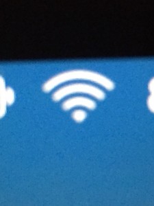 A close-up of the WiFi wave symbols on a computer screen, telling me I am properly connected for once