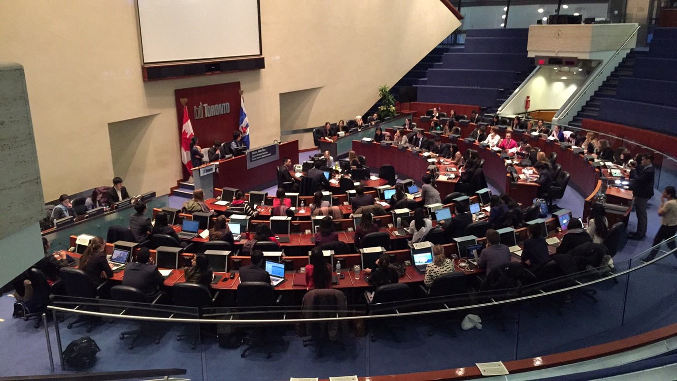 Image of city hall council chamber room with delegates in their seats 