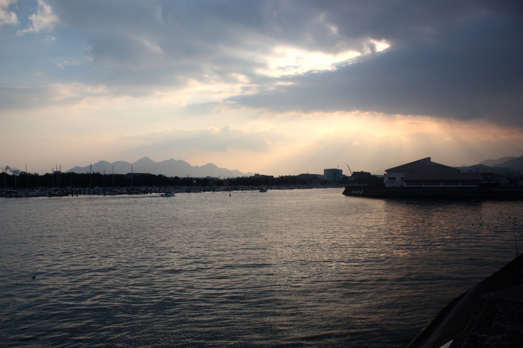 This image shows a view of a port at dusk.