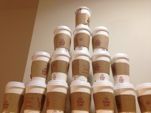 Photo of: a tower of coffee/tea cups stacked high