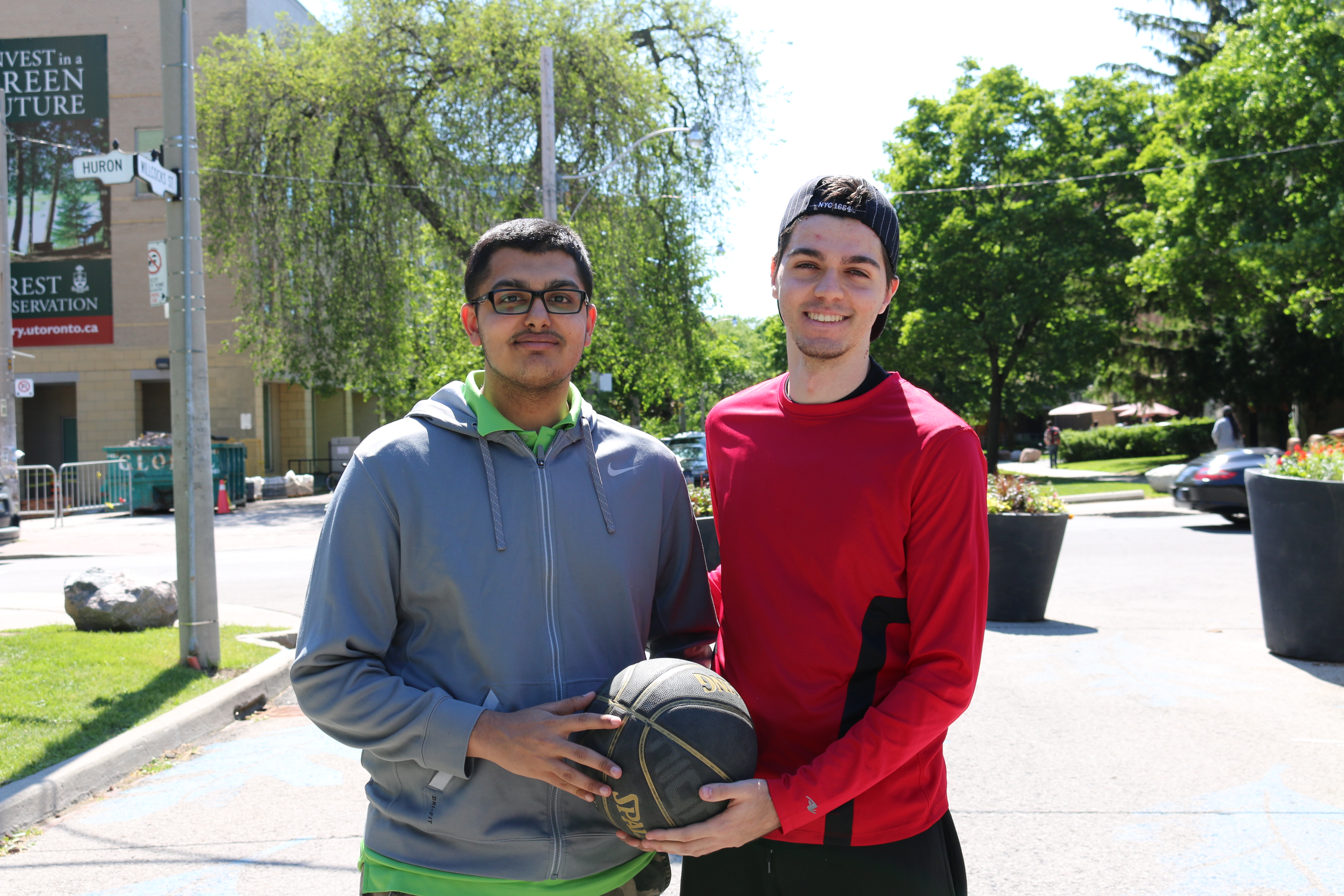 Alen and Nasrullah with a basketball on Wilcocks Commons.