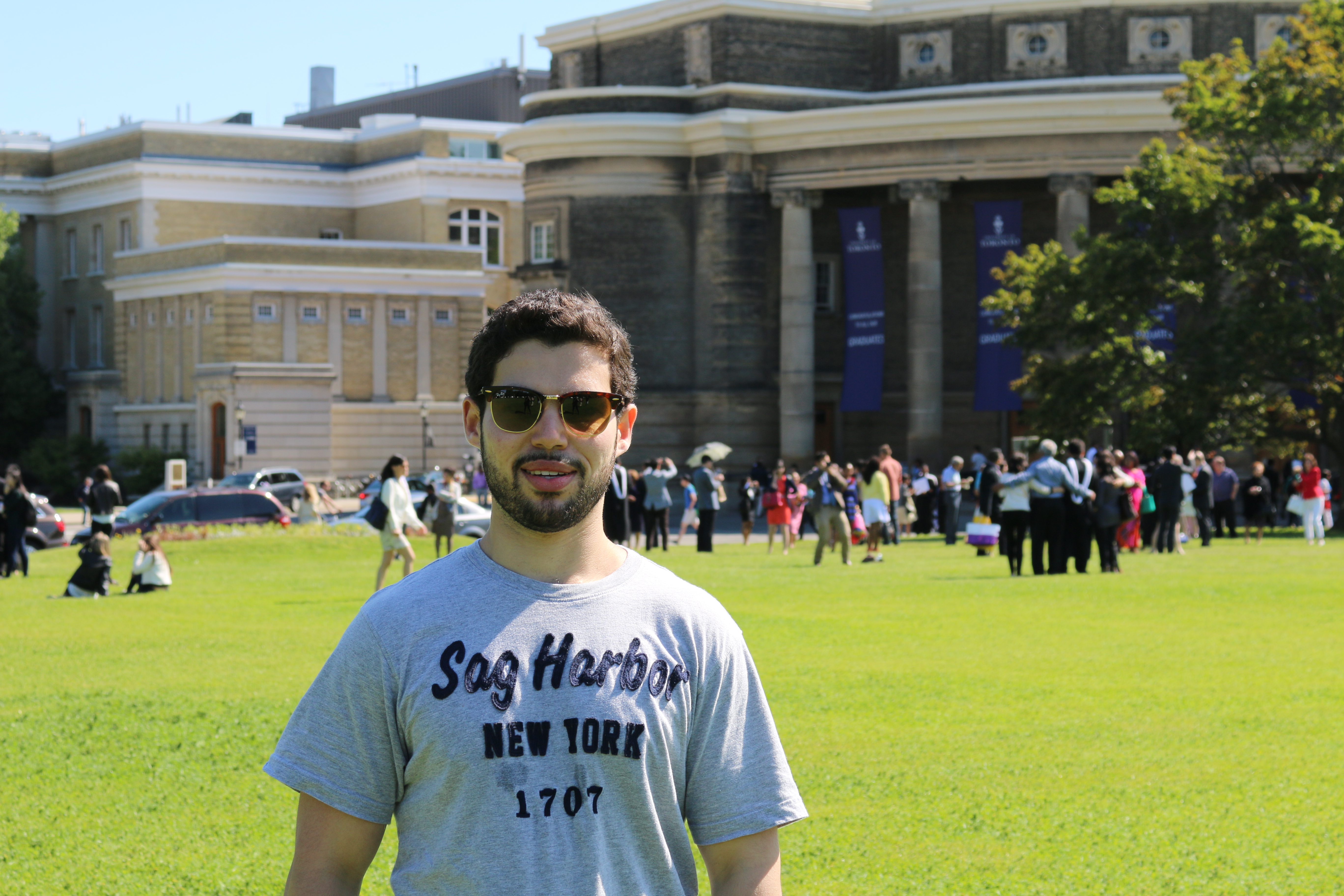 A portrait of David in front of Convocation Hall on Front Campus.