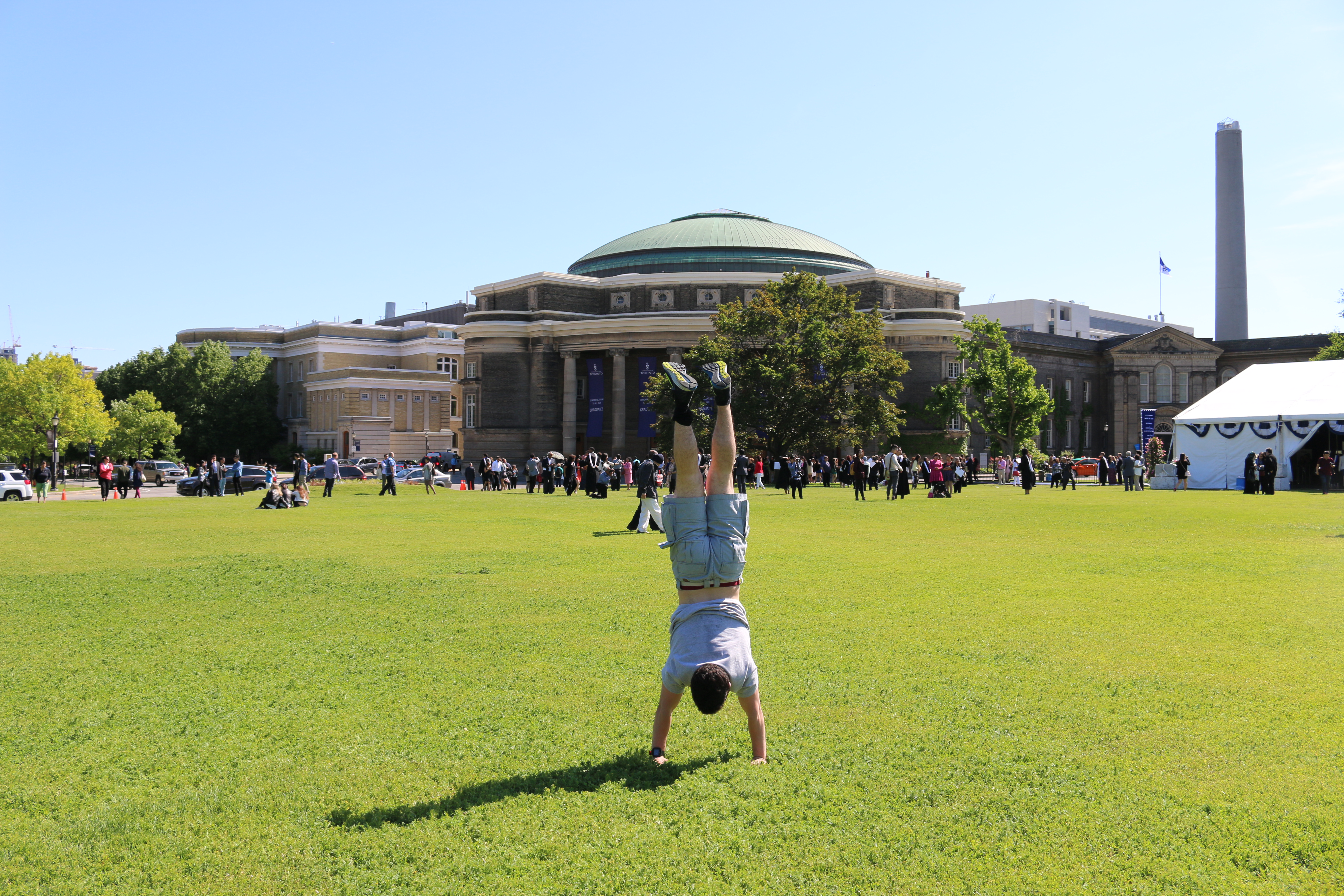 David doing a handstand in front of Convocation Hall.