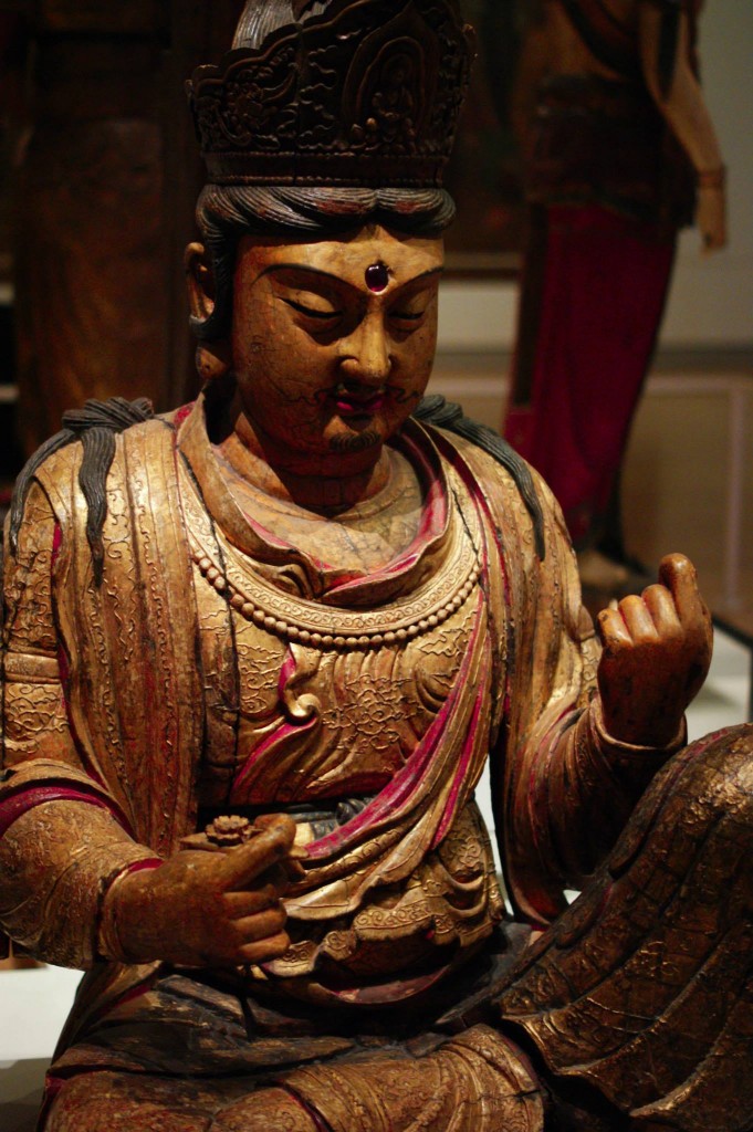 photo of an intricate statue of a buddha like god 