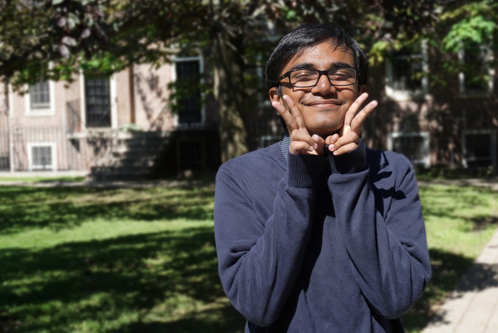 portrait of Alif in front of Whitney Hall 