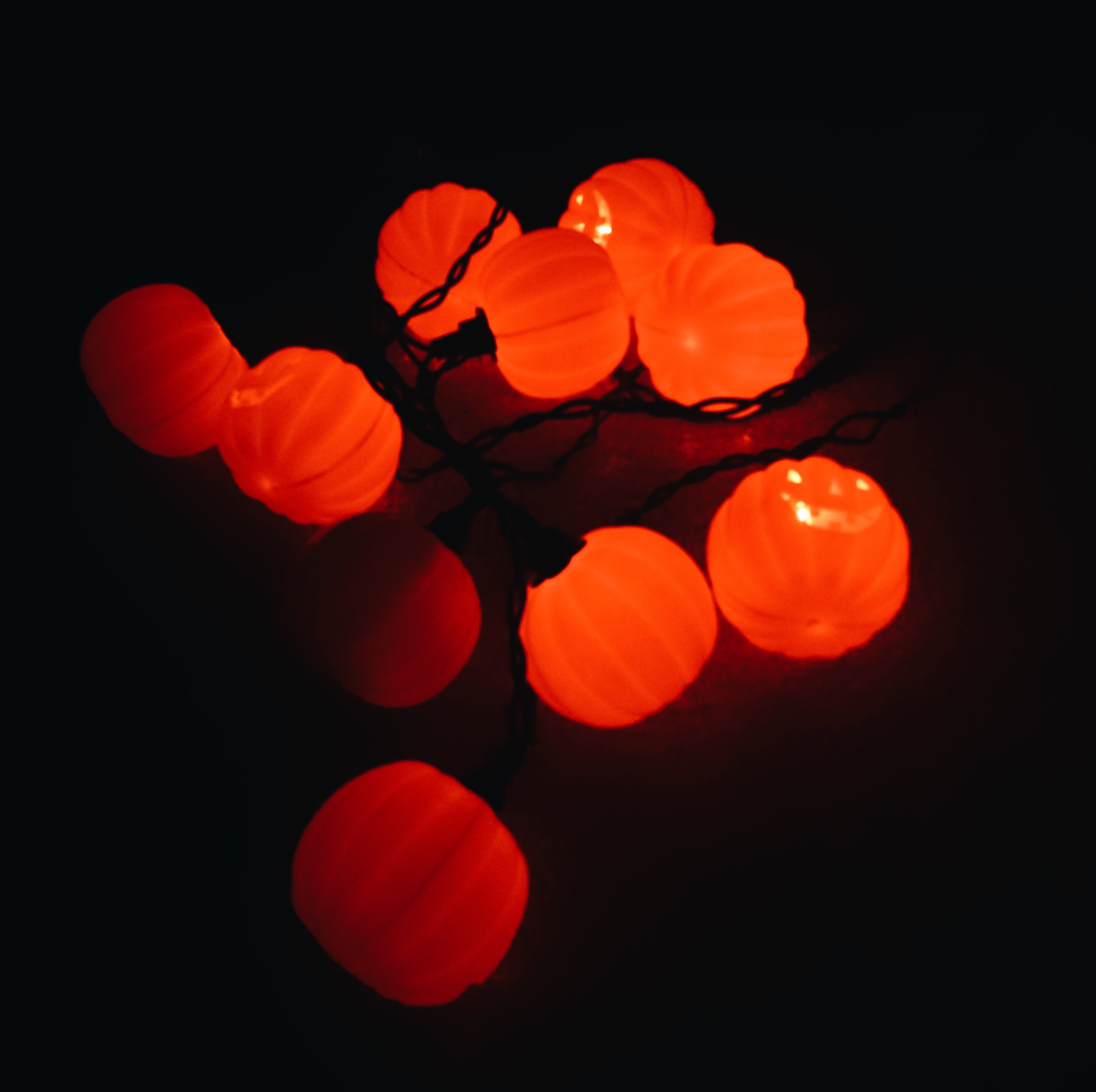 A string of jack-o-lantern orange lights