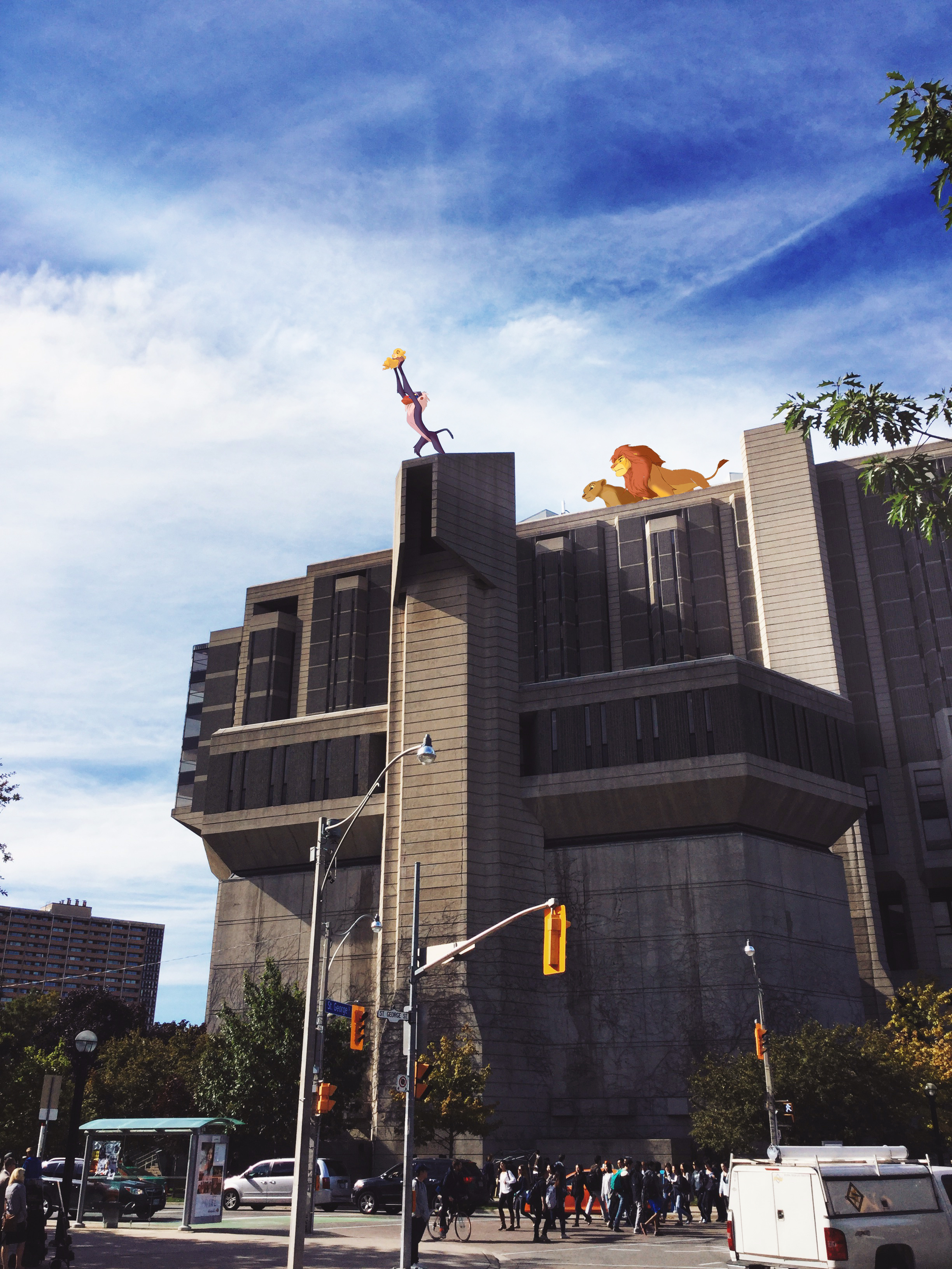 A view of Robarts, as seen from the sidewalk along St. George St. I photoshopped Rafiki and Simba into the angular edge at the top of the building, with sunlight beaming straight down on them. 