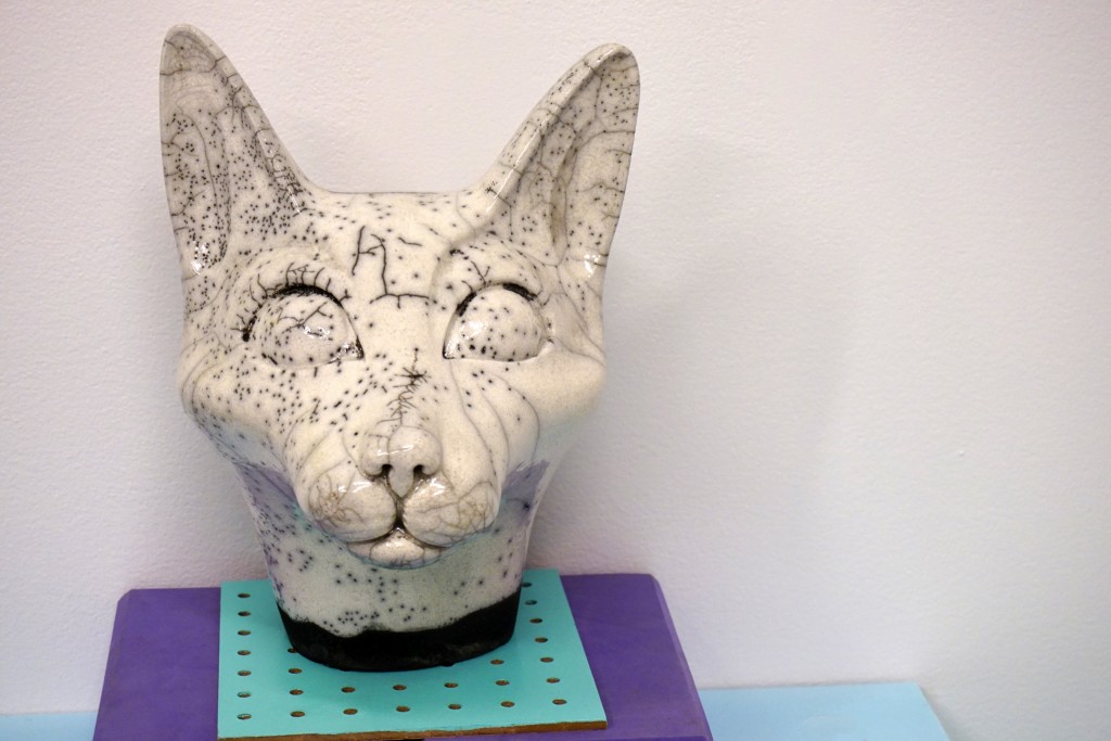 an egyptian style bust of a cat made of marble