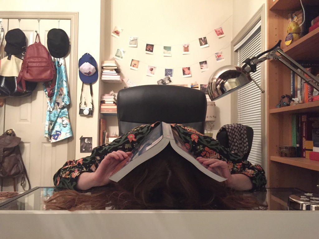 Pictured: me with a textbook over my head
