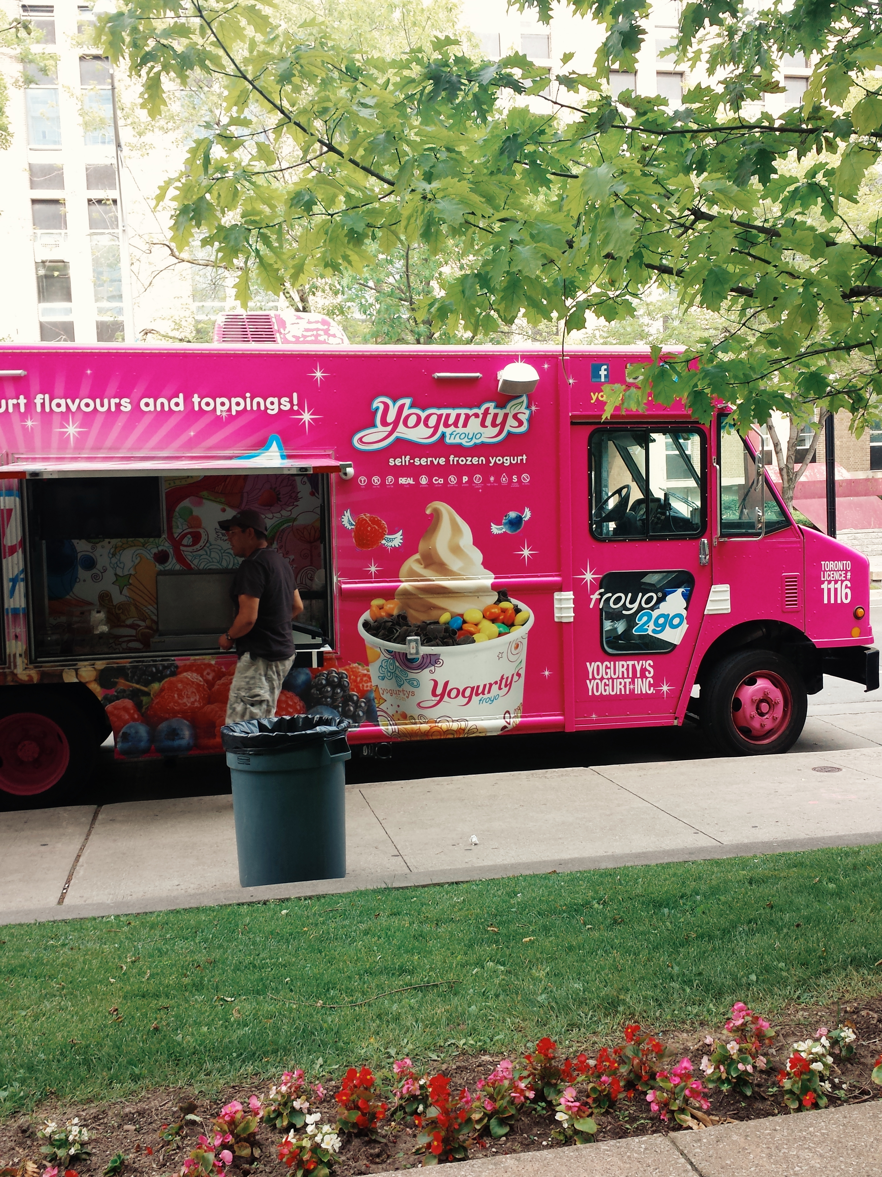 A pink ice cream truck outside Galbraith on a summer day.