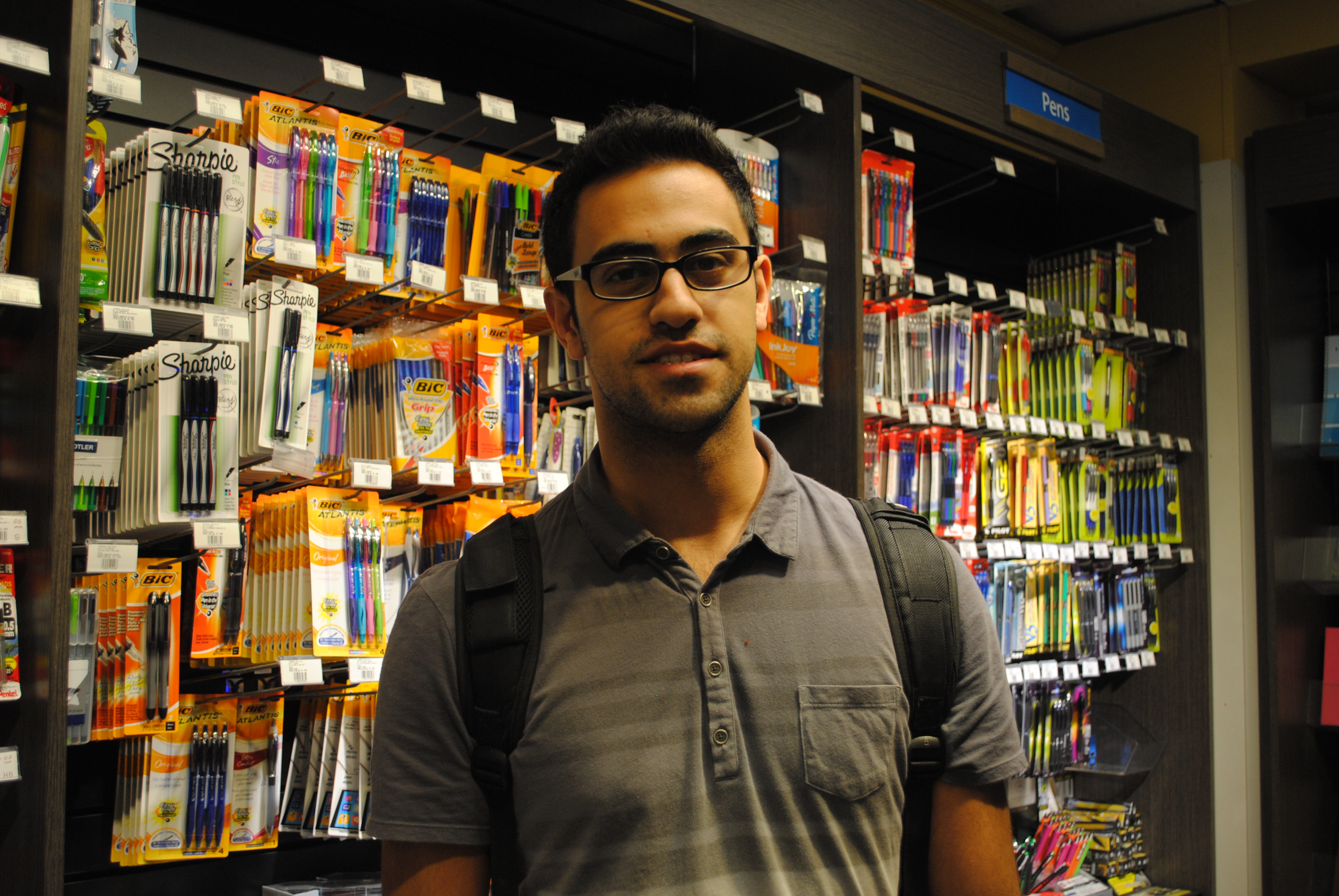 Amirali, in front of the stationary wall at the Bookstore.