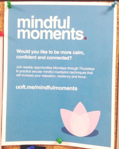 A mindful moments poster; blue with a pink lotus.