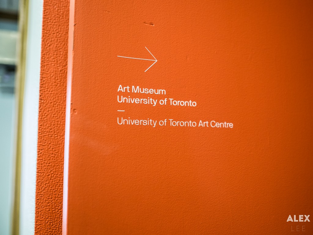 I was greeted by a bright, inviting orange door, decorated only by a neat, sans-serif description and thin arrow.