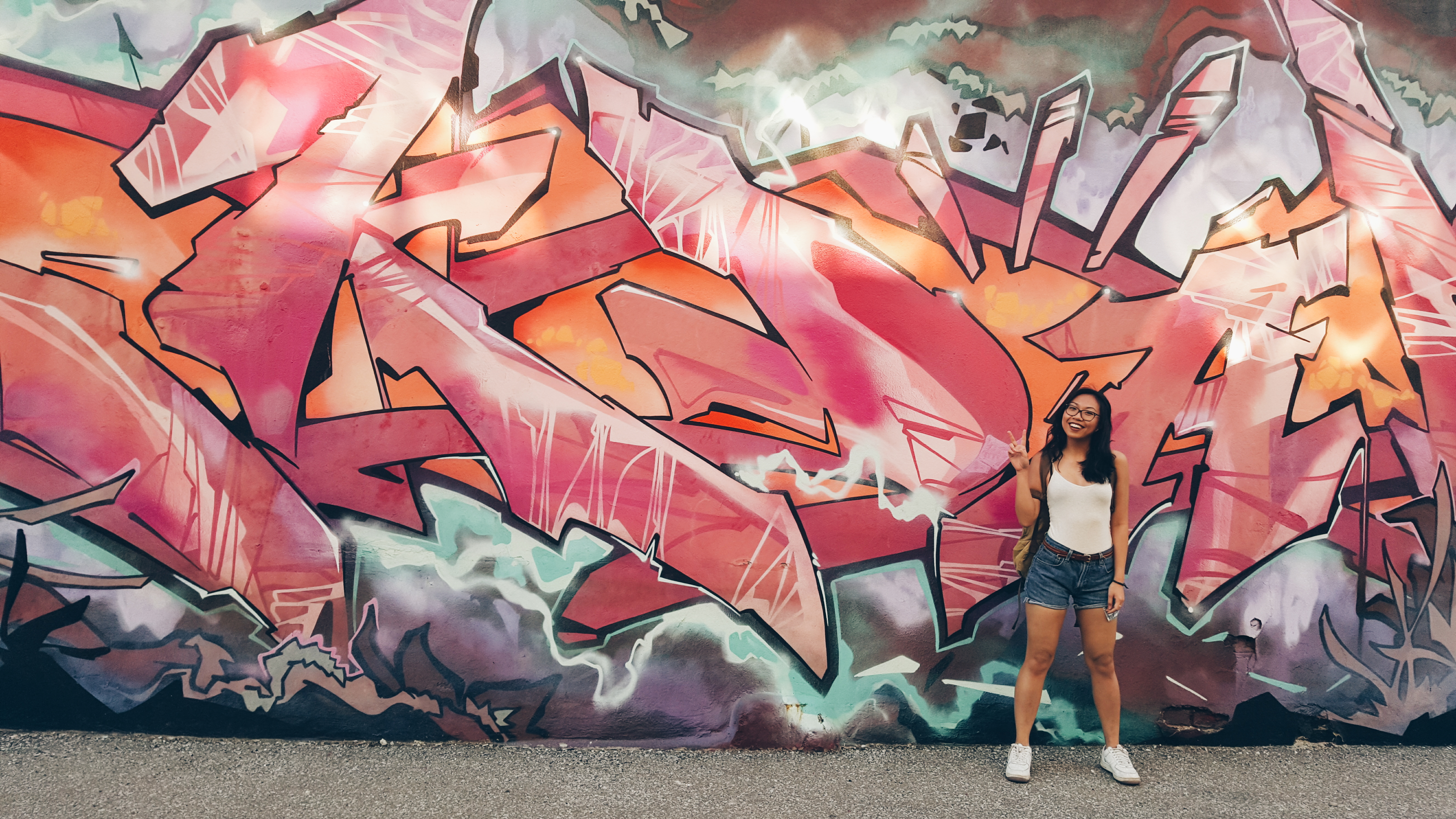 Me standing in front of a graffiti wall. 