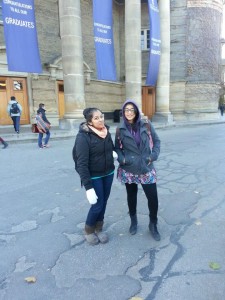 Sargam and a friend standing in front of Con Hall UofT