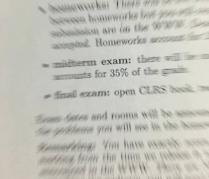 A zoomed in picture of my syllabus, with all the words blurred except "exam" and "35%" to accurately depict the panic I felt when I saw my syllabus. 