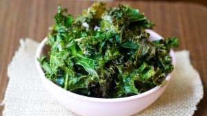 A bowl of kale chips is shown.