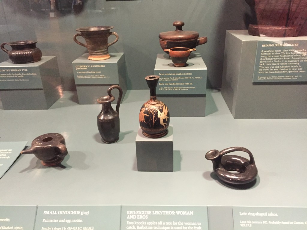 Display of Greek vases: several miniature ones