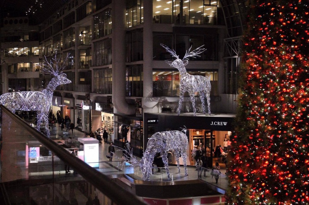 An image of the Eaton Center during the winter holiday season - there are 3 giant reindeer made from LED lights