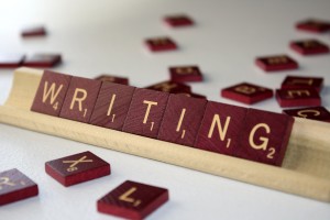 Picture of Scrabble tiles that spell out the word "writing"