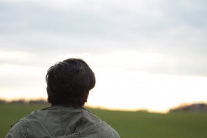 ALT="Photo of my friend watching a field in the distance"
