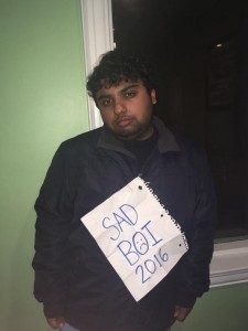 Picture of Avneet with a sign reading "SAD BOI 2016" on his chest.