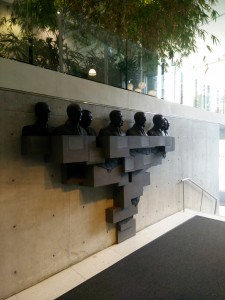 sculpture inside the medical sciences building of notable figures