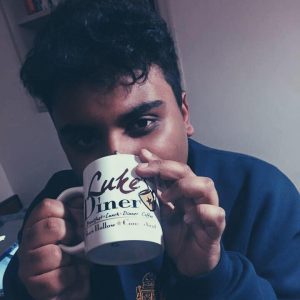 Picture of Avneet with Gilmore Girls mug.