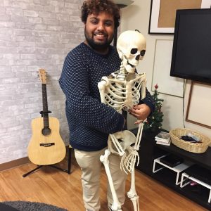 Picture of Avneet posing with a prop skeleton