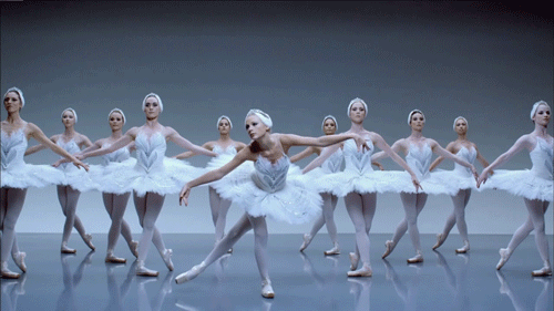 A ballerina falls to the floor among the other dancers, who actually know what they're doing.