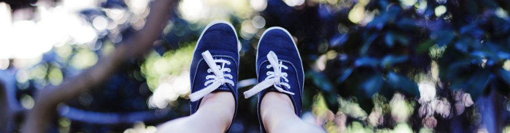 A photo of Emi's feet in her Keds.