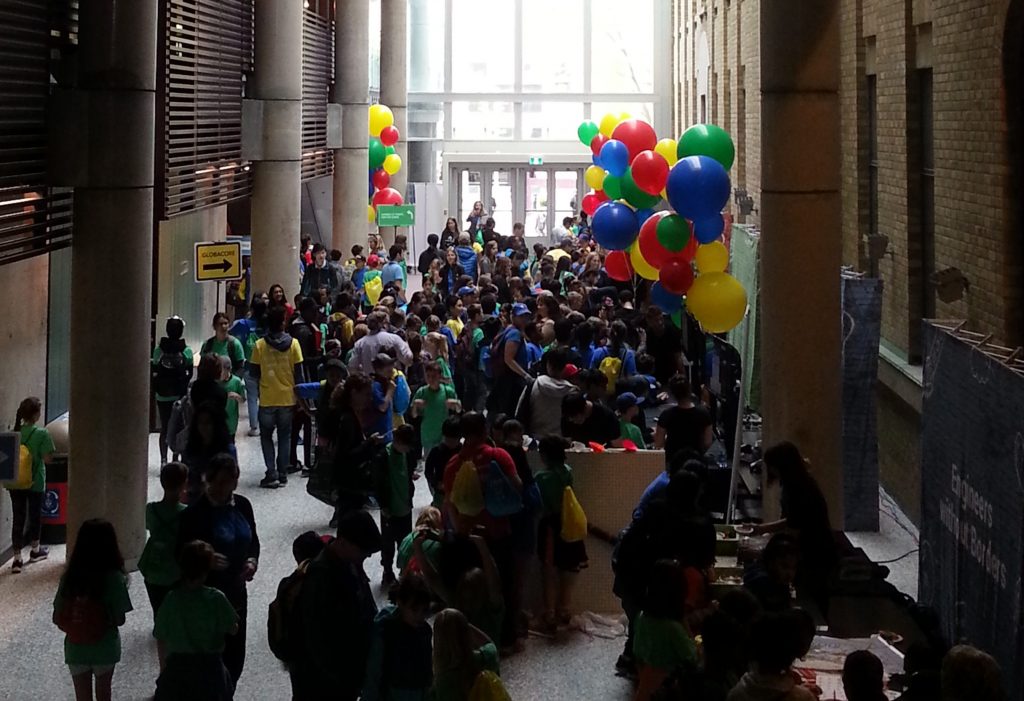 Bahen Centre main hallway decked in balloons and filled with students