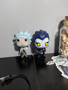 An image of animated characters Rick from "Rick and Morty" and Ryuk from "Death Note"