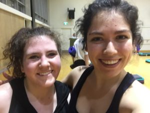 Image of author and friend smiling in workout class