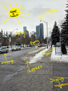 A photo of Hoskin Avenue looking dreary and slushy with snow. Yellow arrows are pointing everywhere saying "slippery". There is a hand-drawn sun in the corner that has a sign saying "GONE 4 LUNCH".