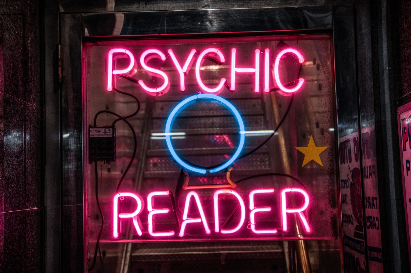A photo of signage at the psychic's office. Caption: Deciding on a POSt would be easier if we were psychic