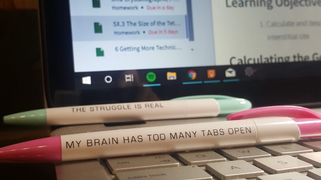 pens that say "the struggle is real" and "My brain has too many tabs open"