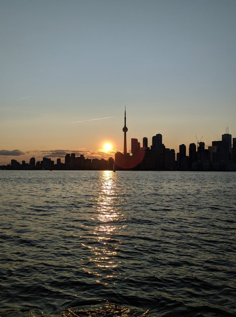 Lake, sunset, and Toronto skyline in the background